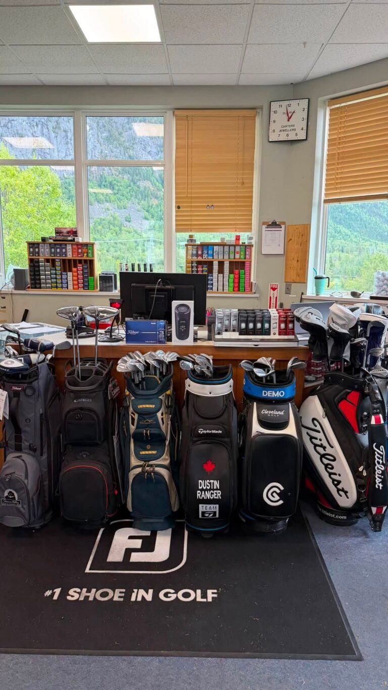 Rows of golf bags lined up inside the clubhouse pro shop.