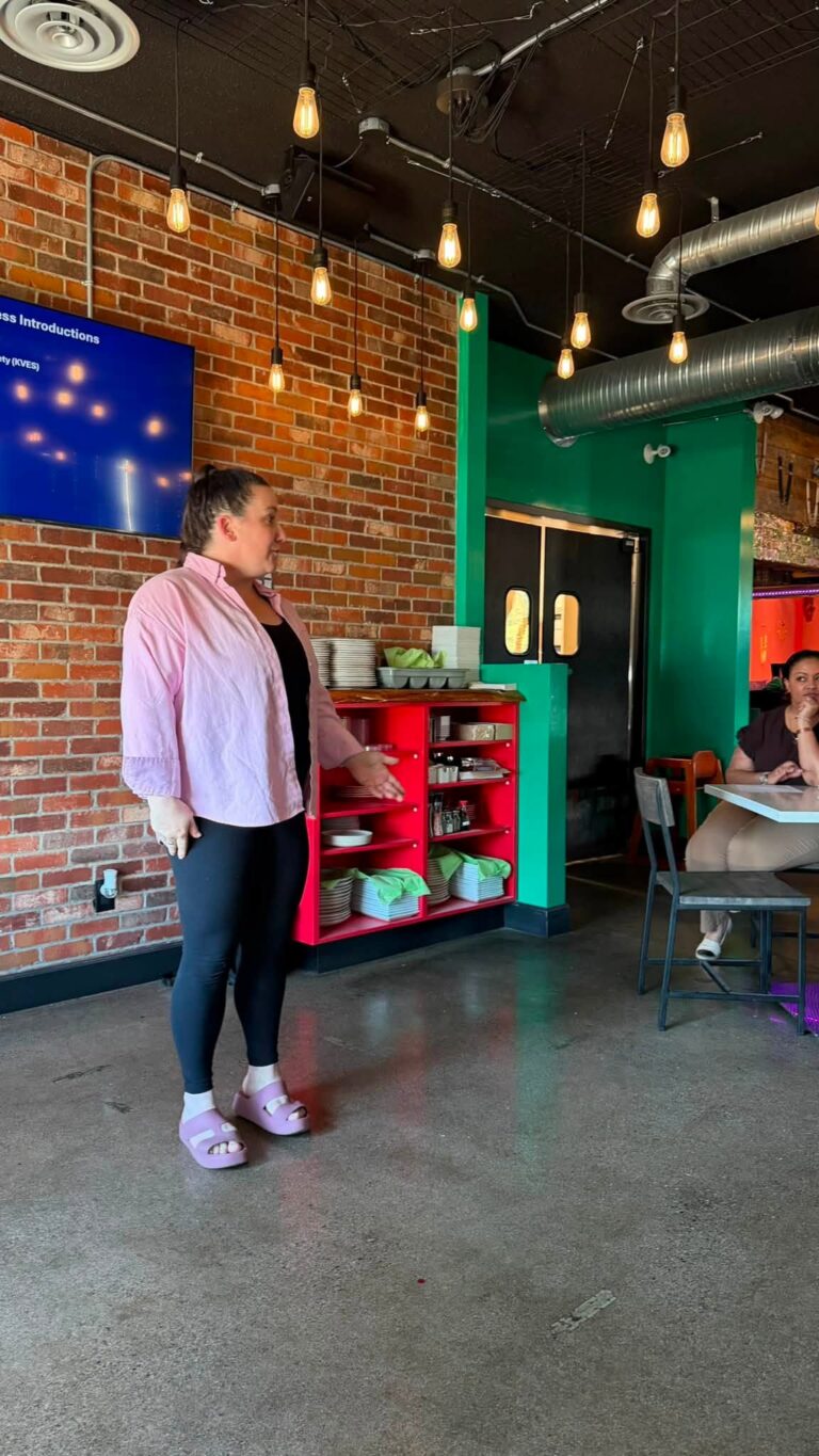 A presenter stands at the front of the restaurant during the pitches.