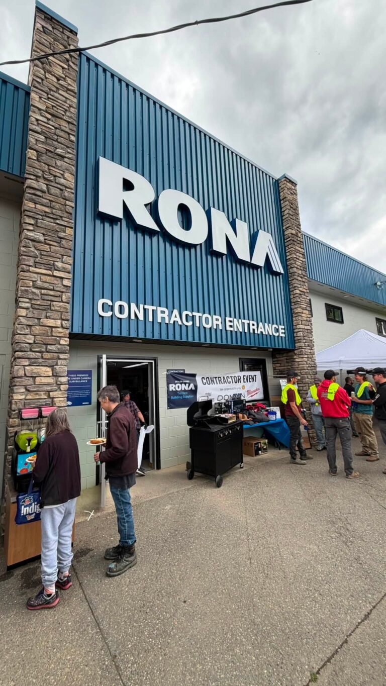RONA contractor entrance with visitors and booths outside.