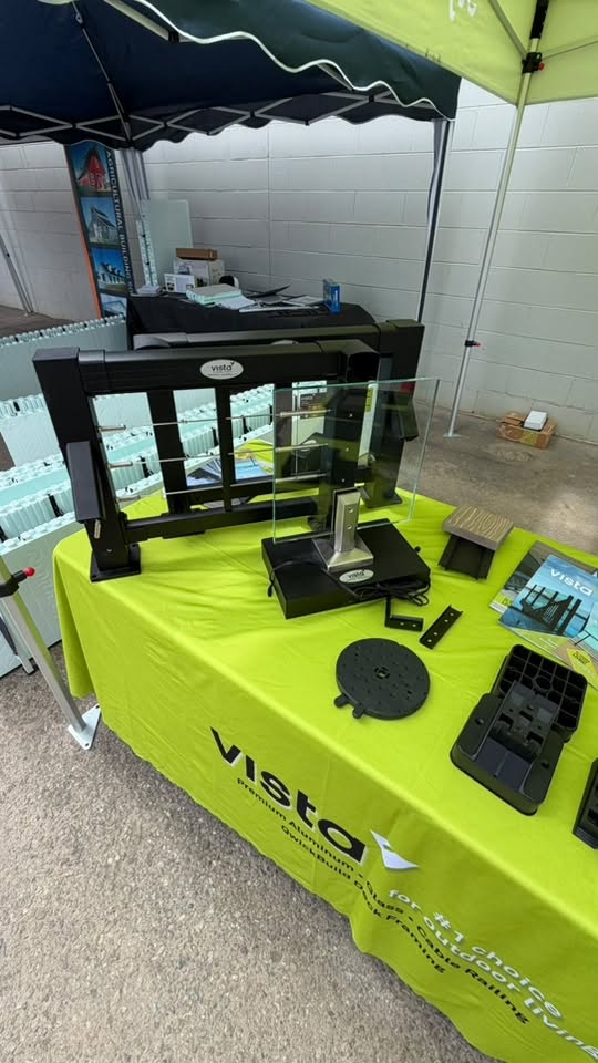 Vendor product display on a green table.