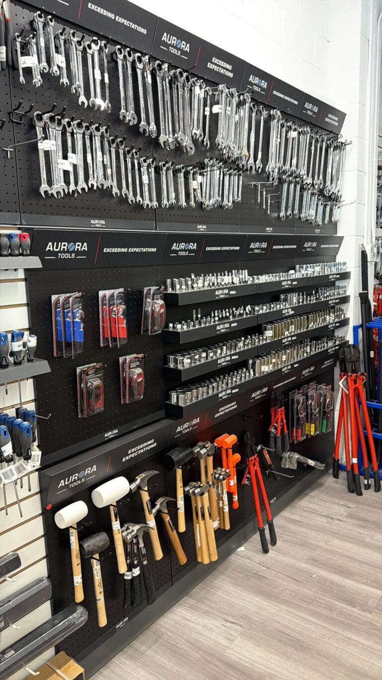 Wall display of Aurora hand tools inside the store.