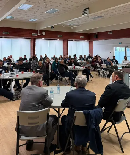 Attendees seated at round tables in the Terrace Sportsplex banquet room at the BC Mining Roadshow.